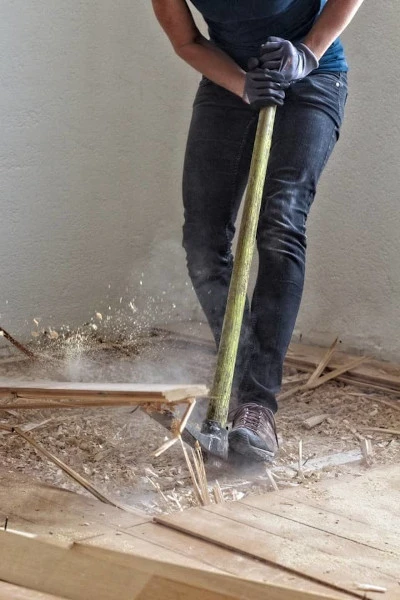 worker pulling up floor